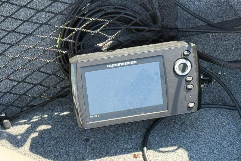 Slide: The Image of Humminbird Helix 5 fish finder on 1999 Alumacraft Tournament Pro 175 CS boat. - 9