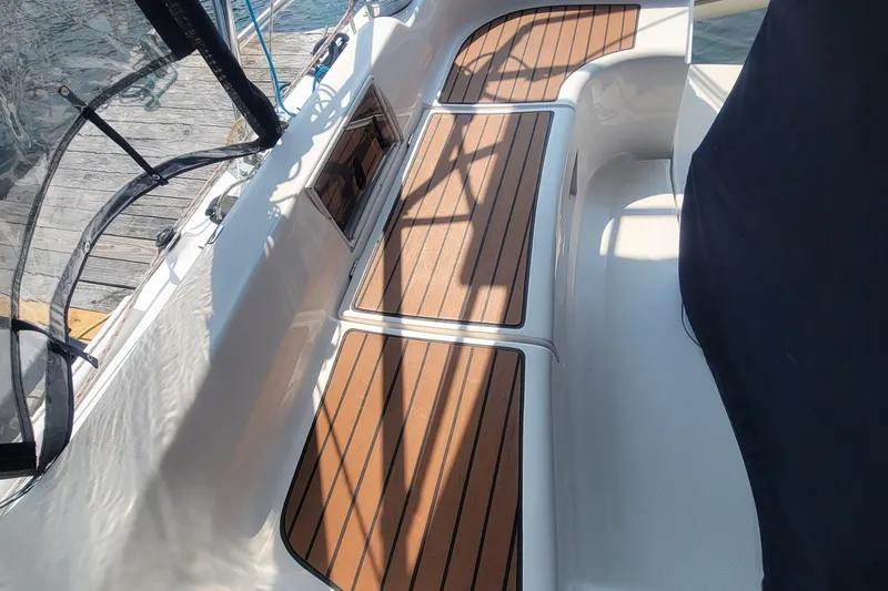 Slide: The Image of 2009 Hunter 38 sailboat cockpit with teak flooring and sleek design. - 10