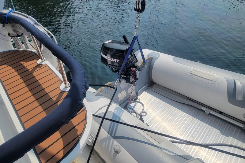 Slide: The Image of Inflatable boat with Mercury motor on 2009 Hunter 38 yacht deck. - 12
