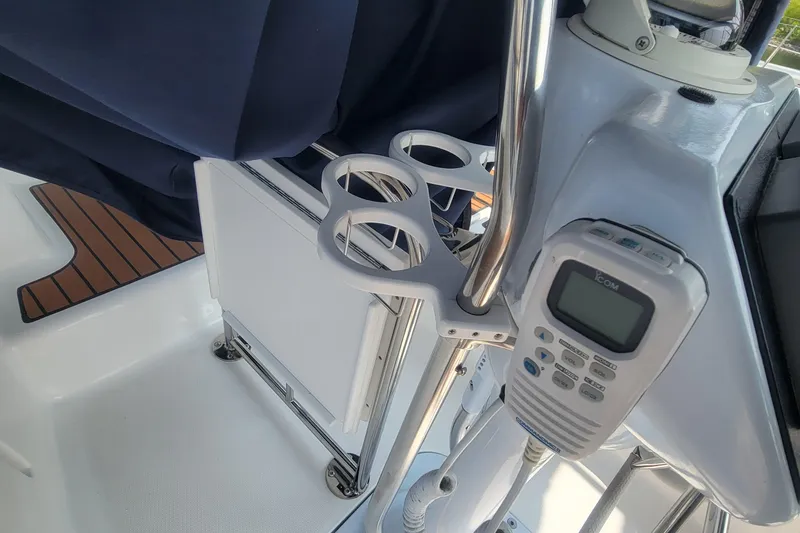 Slide: The Image of 2009 Hunter 38 yacht cockpit with radio and cup holders. - 15