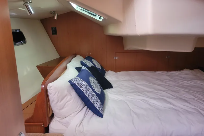 Slide: The Image of Cozy cabin interior of 2009 Hunter 38 sailboat with comfortable bedding and pillows. - 22