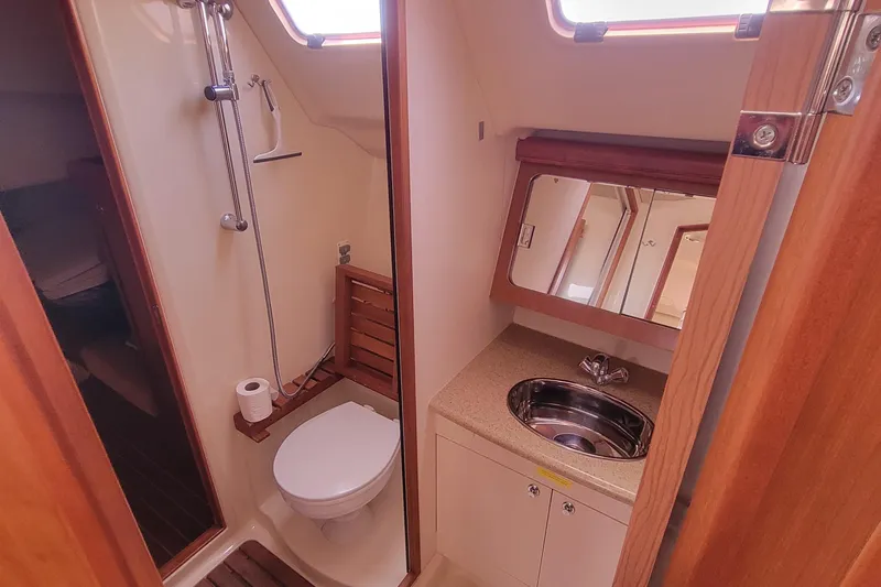 Slide: The Image of 2009 Hunter 38 yacht bathroom with shower, toilet, and sink. - 28