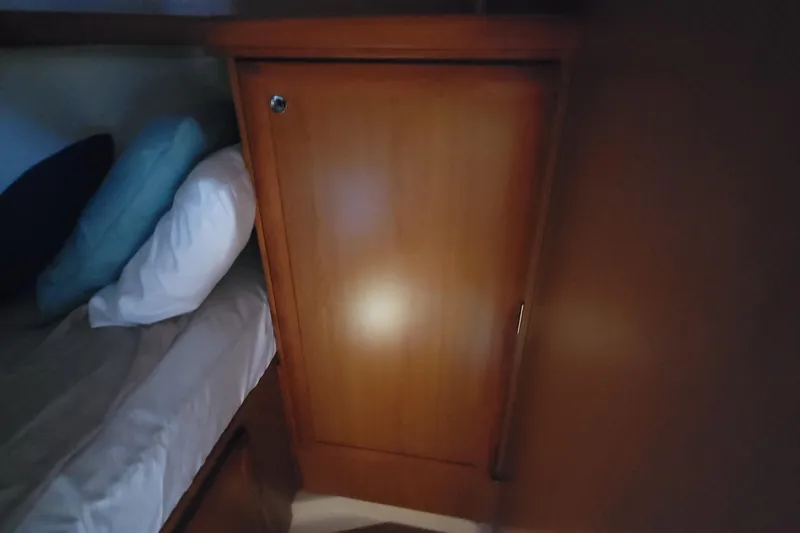 Slide: The Image of Wooden cabinet beside bed in 2009 Hunter 38 yacht interior. - 31