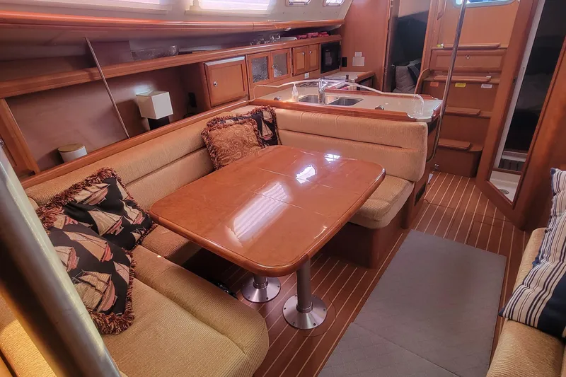 Slide: The Image of Interior of 2009 Hunter 38 sailboat with cozy dining area and kitchen. - 34