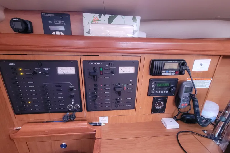 Slide: The Image of Control panel of a 2009 Hunter 38 yacht with navigation and communication equipment. - 35