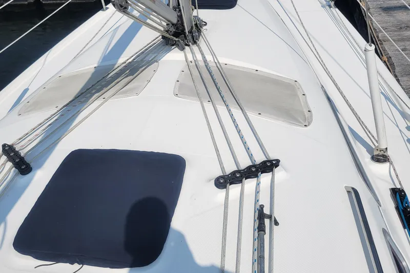 Slide: The Image of Deck of 2009 Hunter 38 sailboat with rigging and hatches. - 43