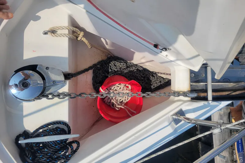 Slide: The Image of Anchor chain and rope storage on 2009 Hunter 38 sailboat deck. - 45