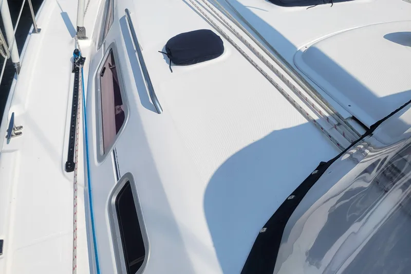 Slide: The Image of 2009 Hunter 38 sailboat deck with windows and rigging details. - 51