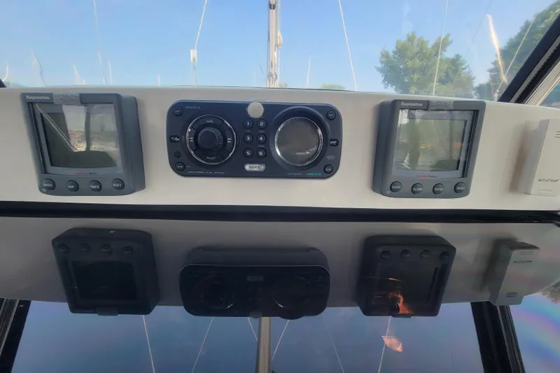 Slide: The Image of Control panel of a 2009 Hunter 38 sailboat with navigation instruments. - 8