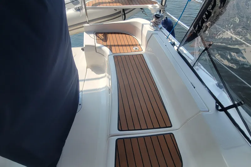 Slide: The Image of Cockpit of 2009 Hunter 38 sailboat with teak flooring and stainless steel fittings. - 9