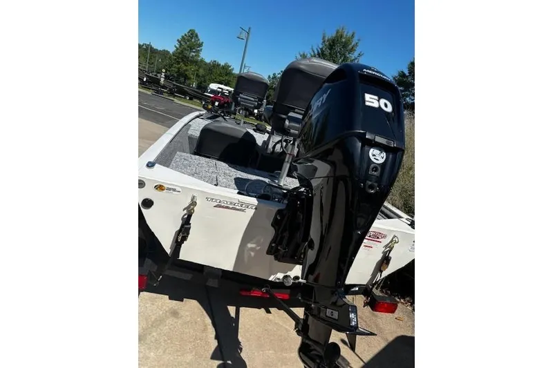 Slide: The Image of 2026 Tracker Pro 170 boat with Mercury 50 engine, parked outdoors. - 4
