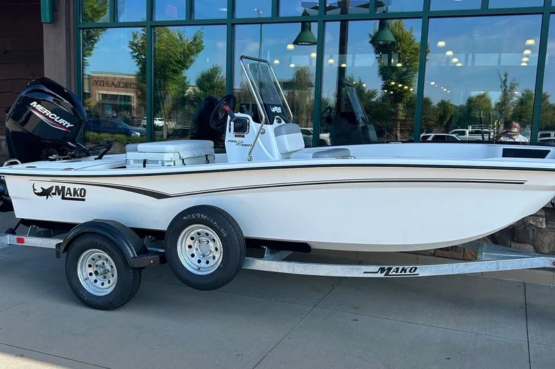 The Image of 2026 Mako Pro Skiff 15 CC boat on trailer, parked outdoors. - 0