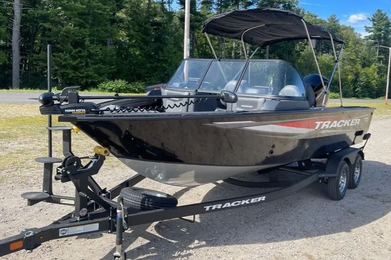 Slide: The Image of 2026 Tracker Targa V-18 WT boat on trailer, parked outdoors. - 3