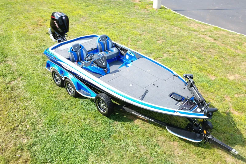 The Image of 2024 Ranger Z520R Ranger Cup Equipped boat on grass, showcasing sleek design and features. - 0