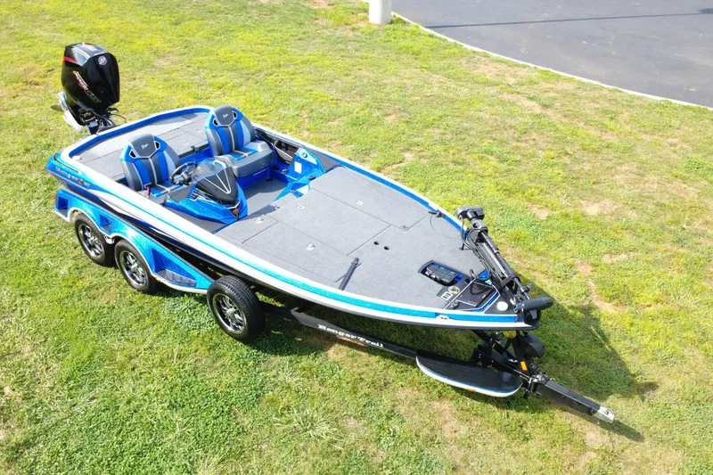 Slide: The Image of 2024 Ranger Z520R Ranger Cup Equipped boat on grass, showcasing sleek design and features. - 9