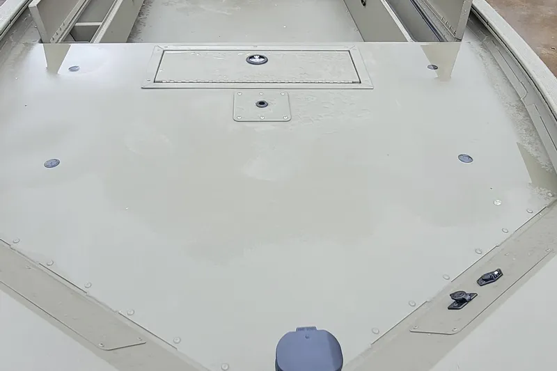 Slide: The Image of 2026 Tracker Grizzly 1654 T Sportsman boat deck, featuring storage compartments and a sleek design. - 3