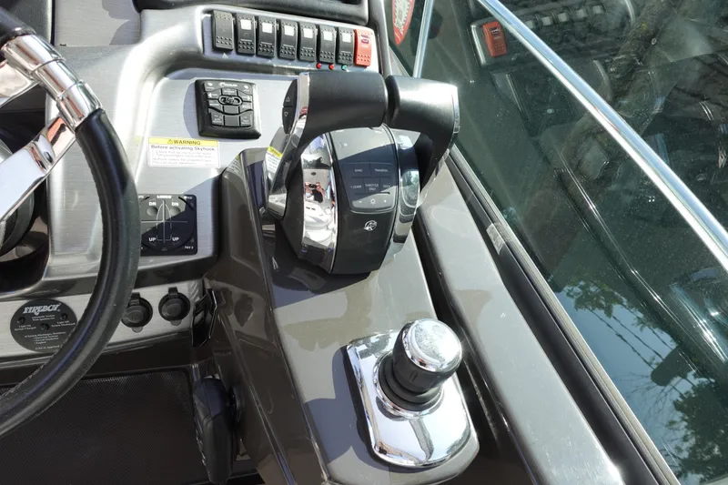 Slide: The Image of Control panel of 2016 Monterey 355 Sport Yacht with steering wheel and throttle levers. - 13