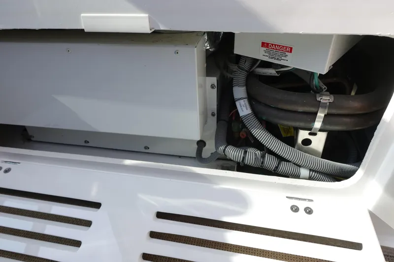 Slide: The Image of Engine compartment of 2016 Monterey 355 Sport Yacht with visible wiring and components. - 16