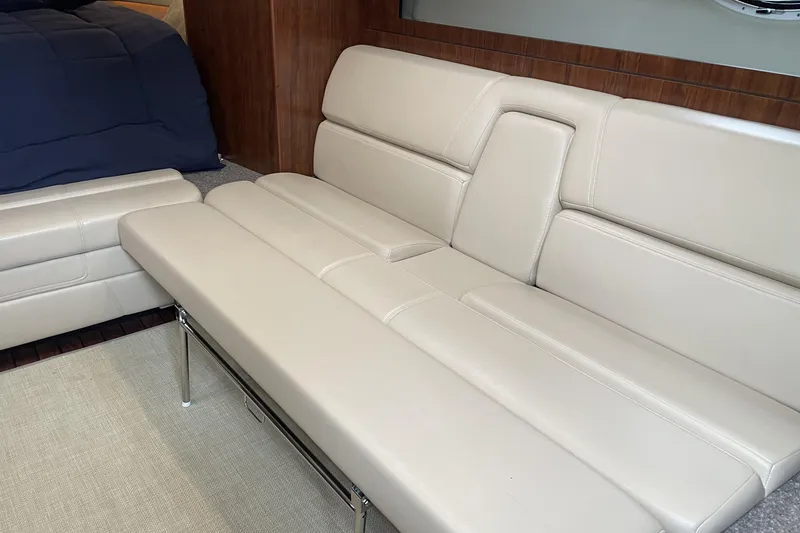 Slide: The Image of Luxurious beige leather seating inside a 2016 Monterey 355 Sport Yacht cabin. - 31