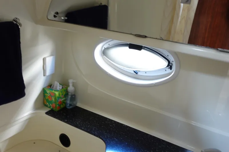 Slide: The Image of Bathroom interior of 2016 Monterey 355 Sport Yacht with oval window and countertop. - 35