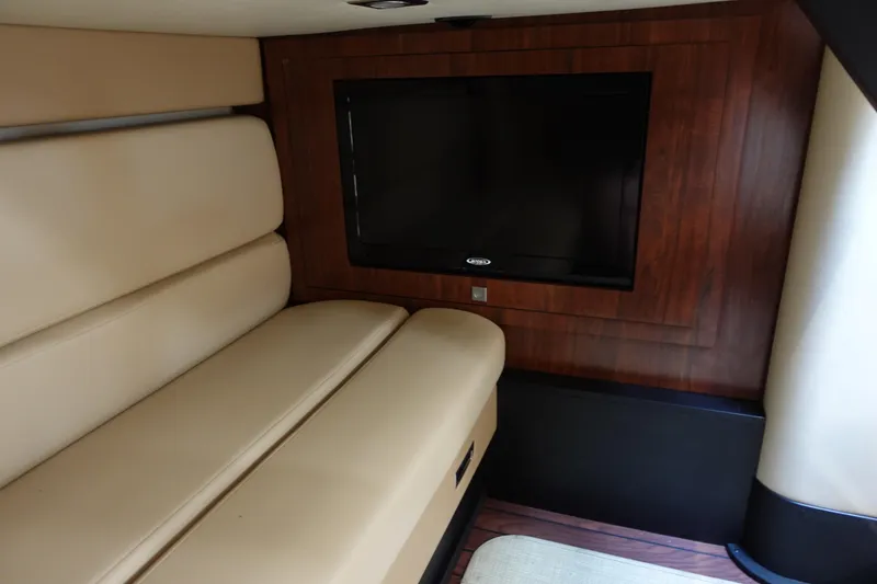 Slide: The Image of Interior of 2016 Monterey 355 Sport Yacht with beige seating and wall-mounted TV. - 36