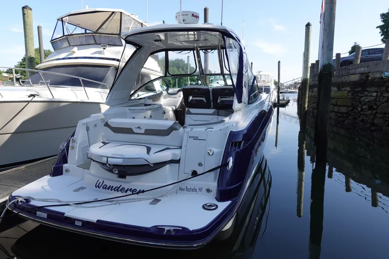 Slide: The Image of 2016 Monterey 355 Sport Yacht docked, rear view, in a marina setting. - 4