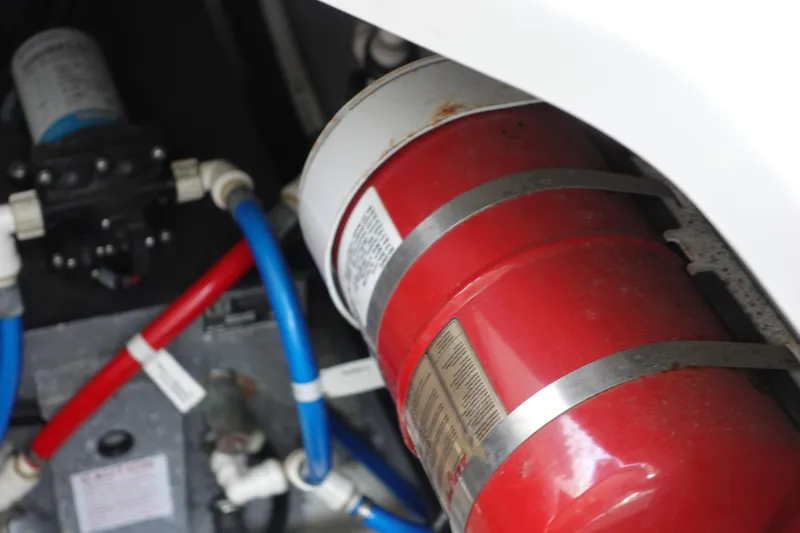 Slide: The Image of Engine compartment of 2015 Monterey 355 Sport Yacht with fire extinguisher and plumbing. - 42