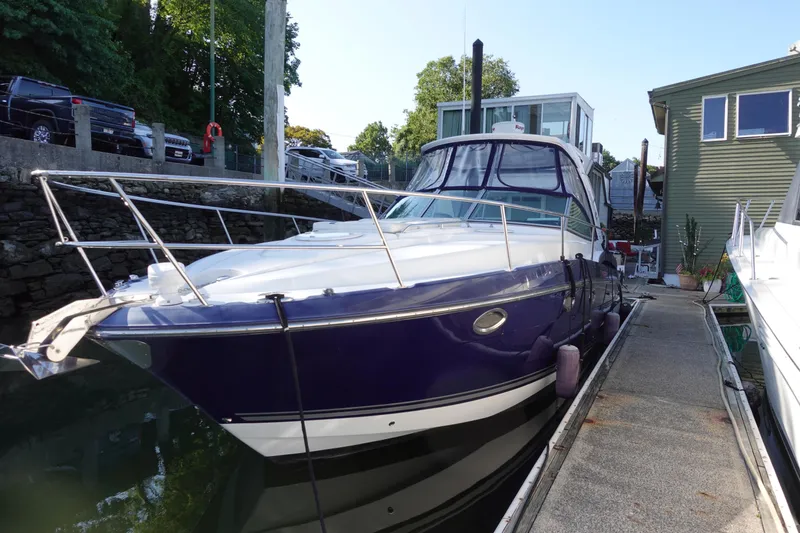 Slide: The Image of 2016 Monterey 355 Sport Yacht docked at marina, side view. - 5