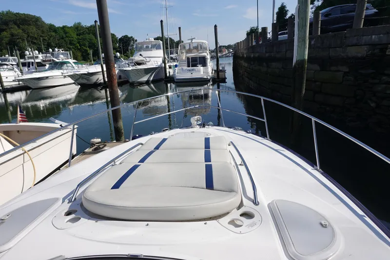 Slide: The Image of 2016 Monterey 355 Sport Yacht docked in a marina, surrounded by other boats. - 6