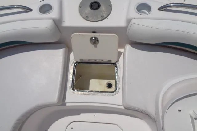 Slide: The Image of 2005 Hurricane GS211 boat interior with open storage compartment. - 19