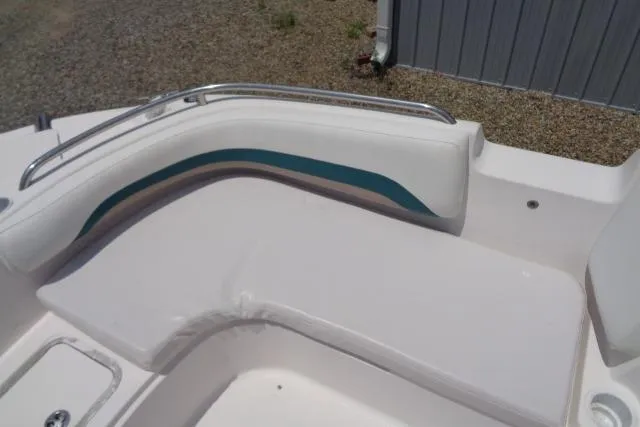 Slide: The Image of 2005 Hurricane GS211 boat seating with white and teal upholstery. - 21