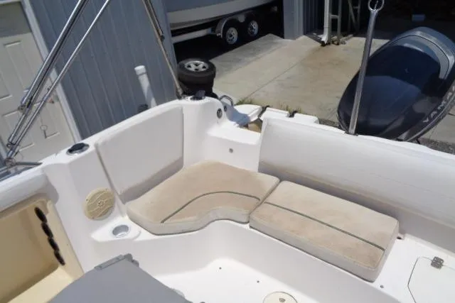 Slide: The Image of Interior view of a 2005 Hurricane GS211 boat with cushioned seating. - 33