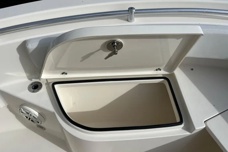 Slide: The Image of Open storage compartment on 2020 Cobia 201 Center Console boat. - 10