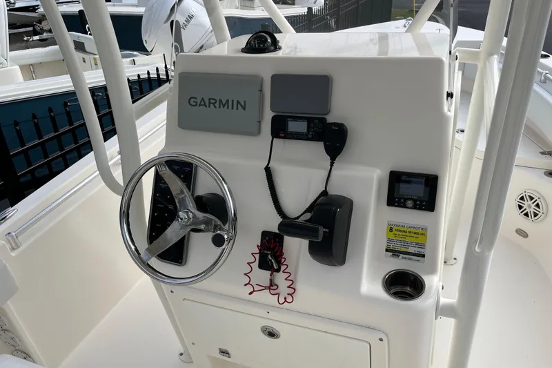 Slide: The Image of 2020 Cobia 201 Center Console boat dashboard with Garmin navigation system. - 12