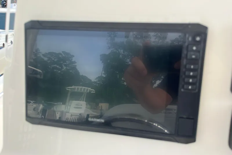 Slide: The Image of 2020 Cobia 201 Center Console boat dashboard with electronic display screen. - 13