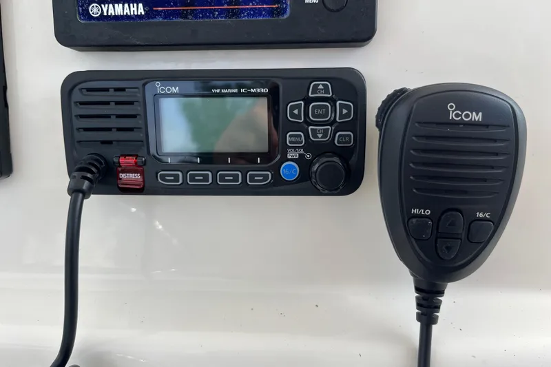 Slide: The Image of Icom VHF Marine IC-M330 radio and microphone on 2020 Cobia 201 Center Console boat. - 14