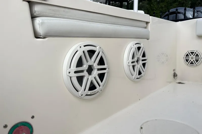 Slide: The Image of 2020 Cobia 201 Center Console boat speakers and seating detail. - 19