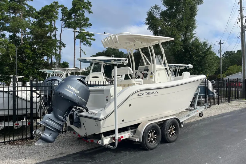 Slide: The Image of 2020 Cobia 201 Center Console boat on trailer with Yamaha outboard motor. - 2