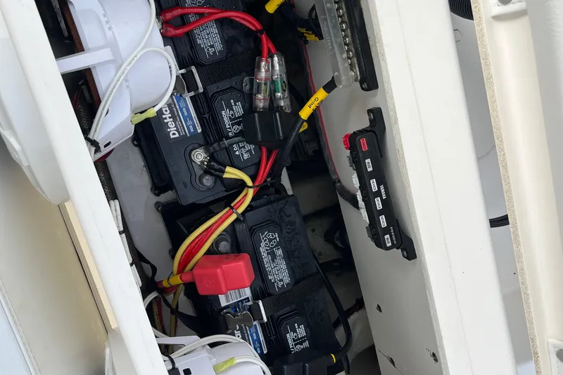Slide: The Image of Electrical wiring and battery setup in a 2020 Cobia 201 Center Console boat. - 20