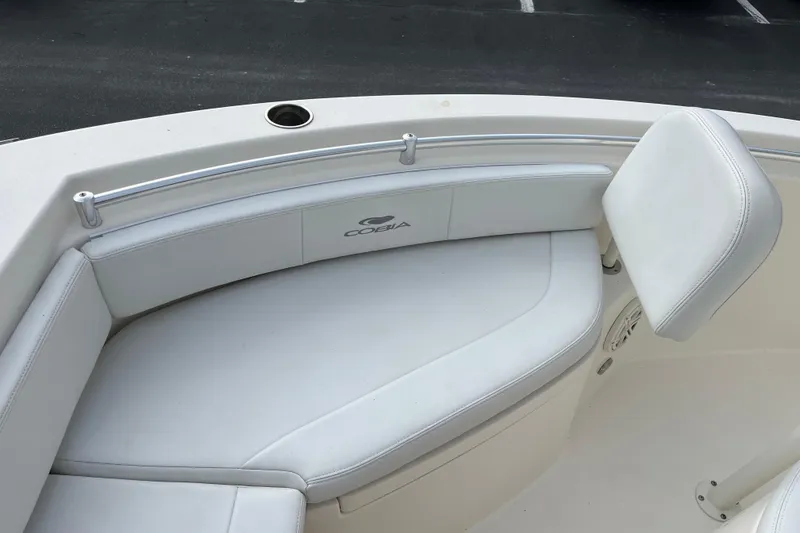 Slide: The Image of 2020 Cobia 201 Center Console boat with white cushioned seating. - 5