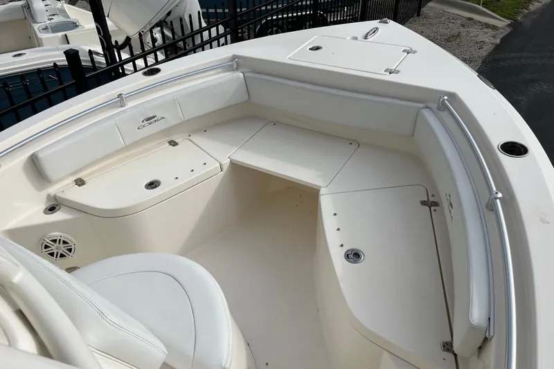 Slide: The Image of 2020 Cobia 201 Center Console boat interior with seating and storage compartments. - 6