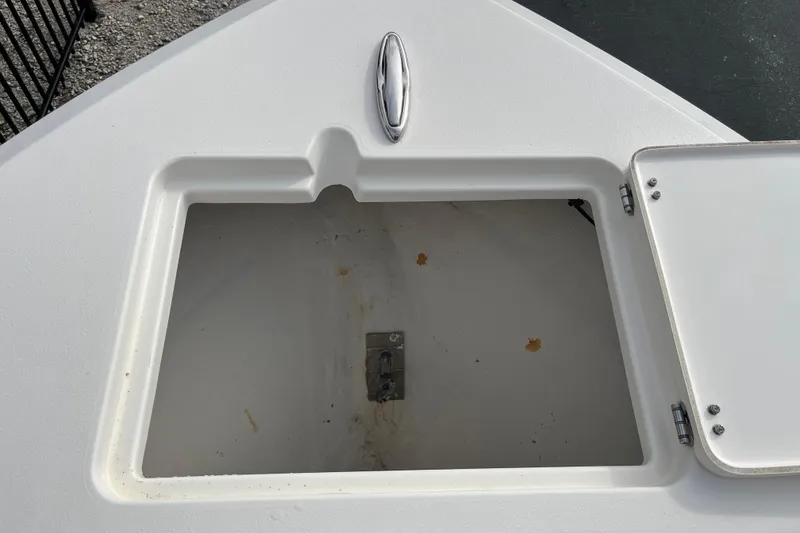 Slide: The Image of Open storage compartment on a 2020 Cobia 201 Center Console boat. - 8