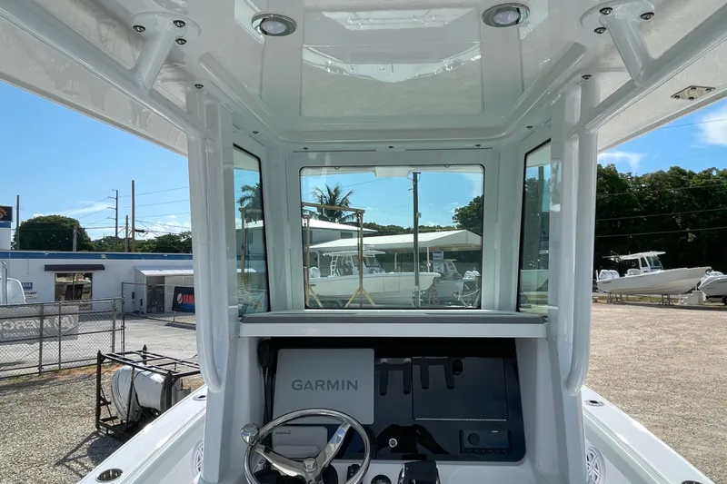 Slide: The Image of Interior view of 2026 Blackfin 242HB boat with Garmin navigation system. - 12