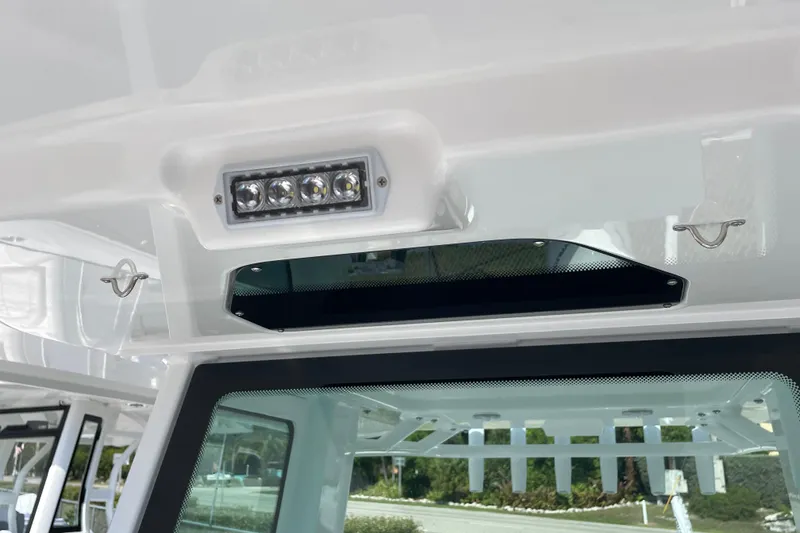 Slide: The Image of 2026 Blackfin 242HB boat interior with LED lighting and sleek design elements. - 19