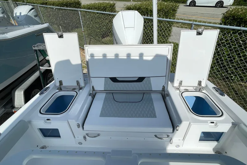 Slide: The Image of 2026 Blackfin 242HB boat interior with open storage compartments and seating. - 23