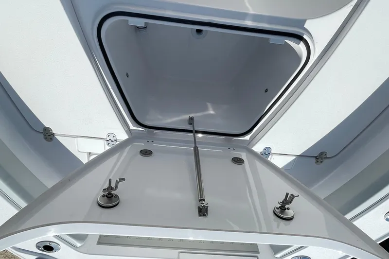 Slide: The Image of Open storage compartment on 2026 Blackfin 242HB boat, showcasing interior details. - 6