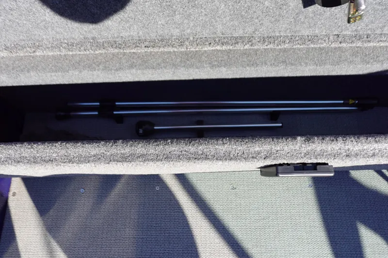 Slide: The Image of Storage compartment in 2025 G3 AV19SF boat, containing metal rods. - 24