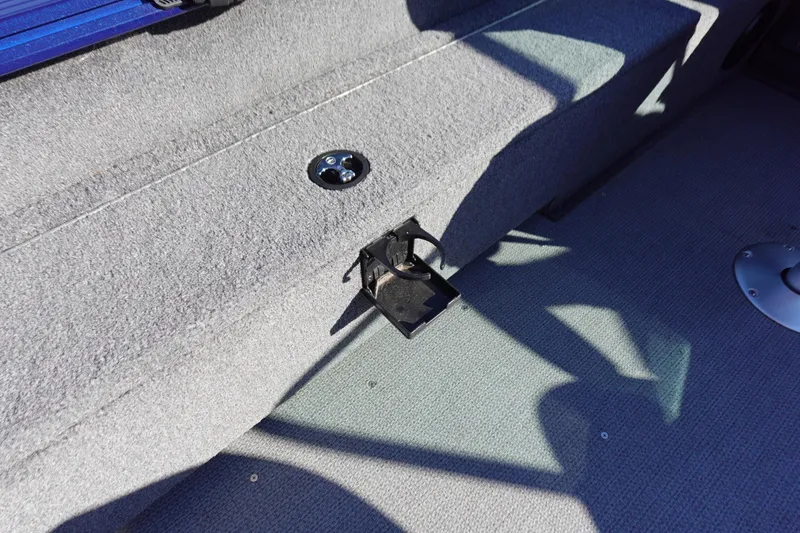 Slide: The Image of Interior of 2025 G3 AV19SF boat showing carpeted flooring and metal fixtures. - 25