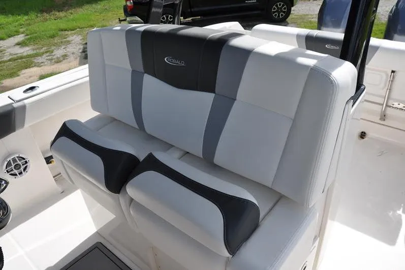Slide: The Image of 2023 Robalo R272 Center Console boat seating with stylish gray and white upholstery. - 19