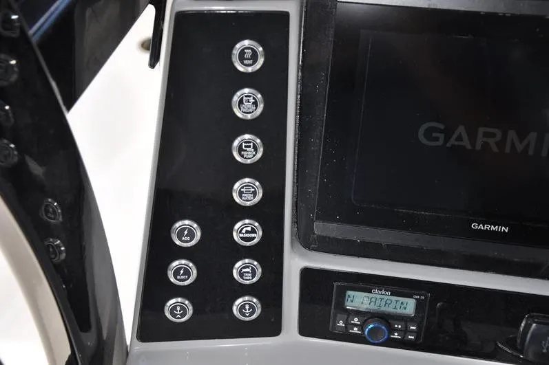 Slide: The Image of 2023 Robalo R272 Center Console dashboard with Garmin display and control panel. - 24